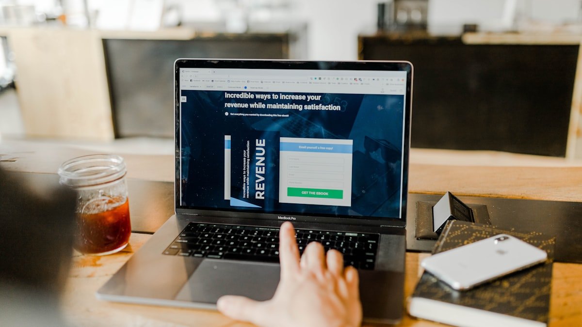 Credit score report and analytics chart on screen representing credit factor optimization